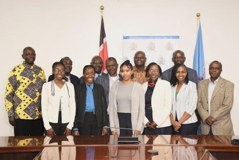 The first group of students with UoN management during the flagging off ceremony