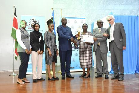 Directorate of University Advancement staff led by the Director, Mr. Brian Ouma receive their award from the Vice Chancellor, Prof Margaret Hutchinson