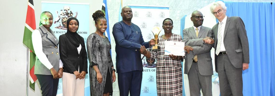 DUAID Staff receive their award from the VC, Prof Margaret Hutchinson