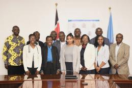 The first group of students with UoN management during the flagging off ceremony